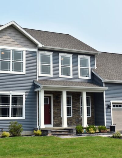 exterior of a new construction home with blue siding