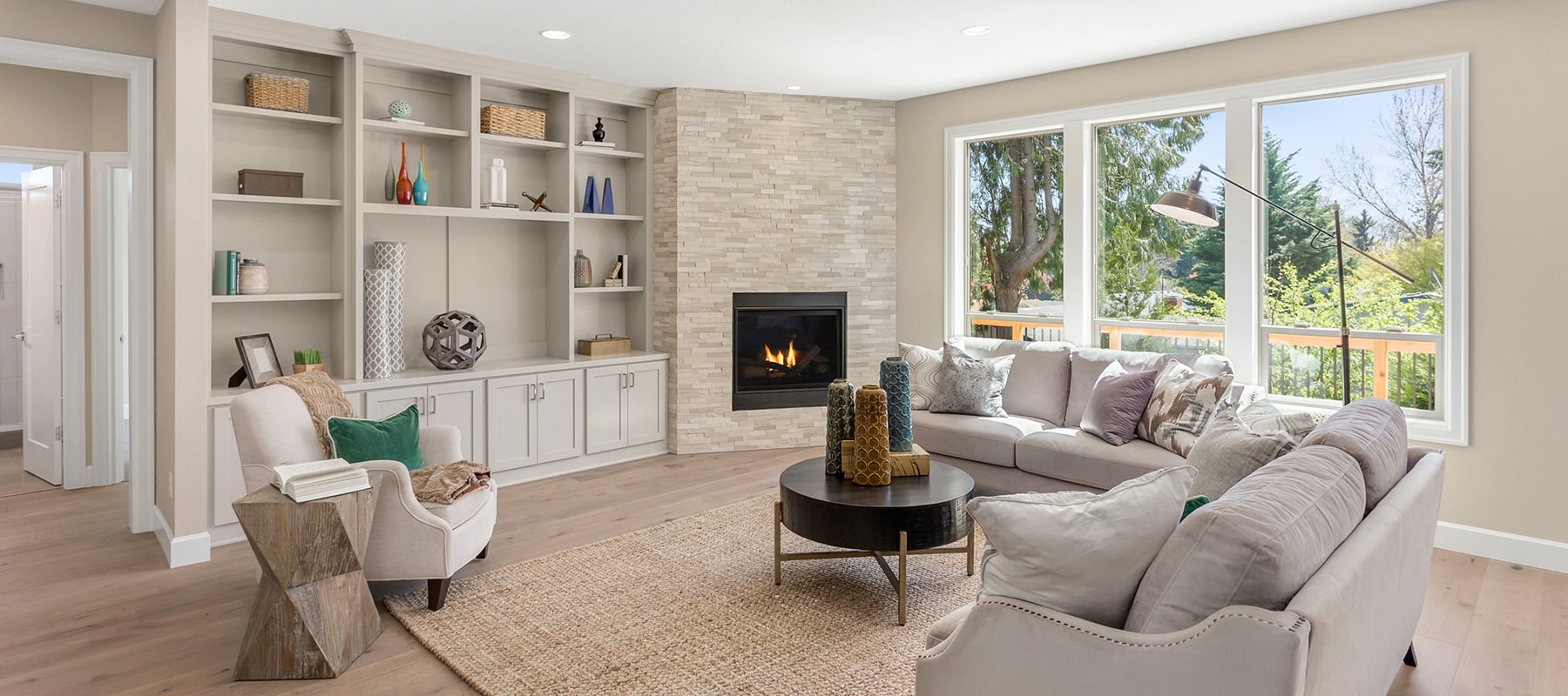 Living room with fireplace and built-in shelves
